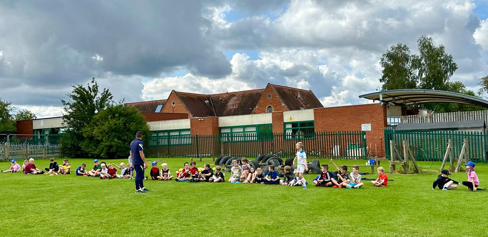 Football coach training children